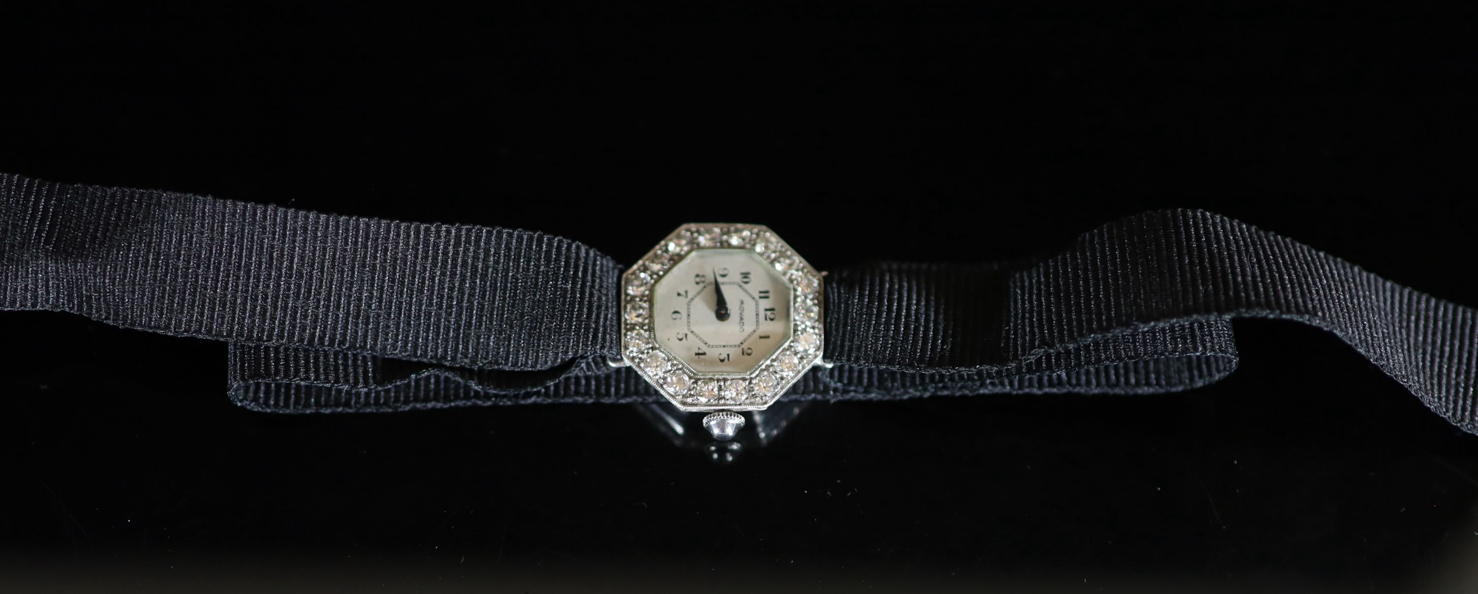 A 1930's/1940's platinum and diamond set Movado octagonal manual wind cocktail watch